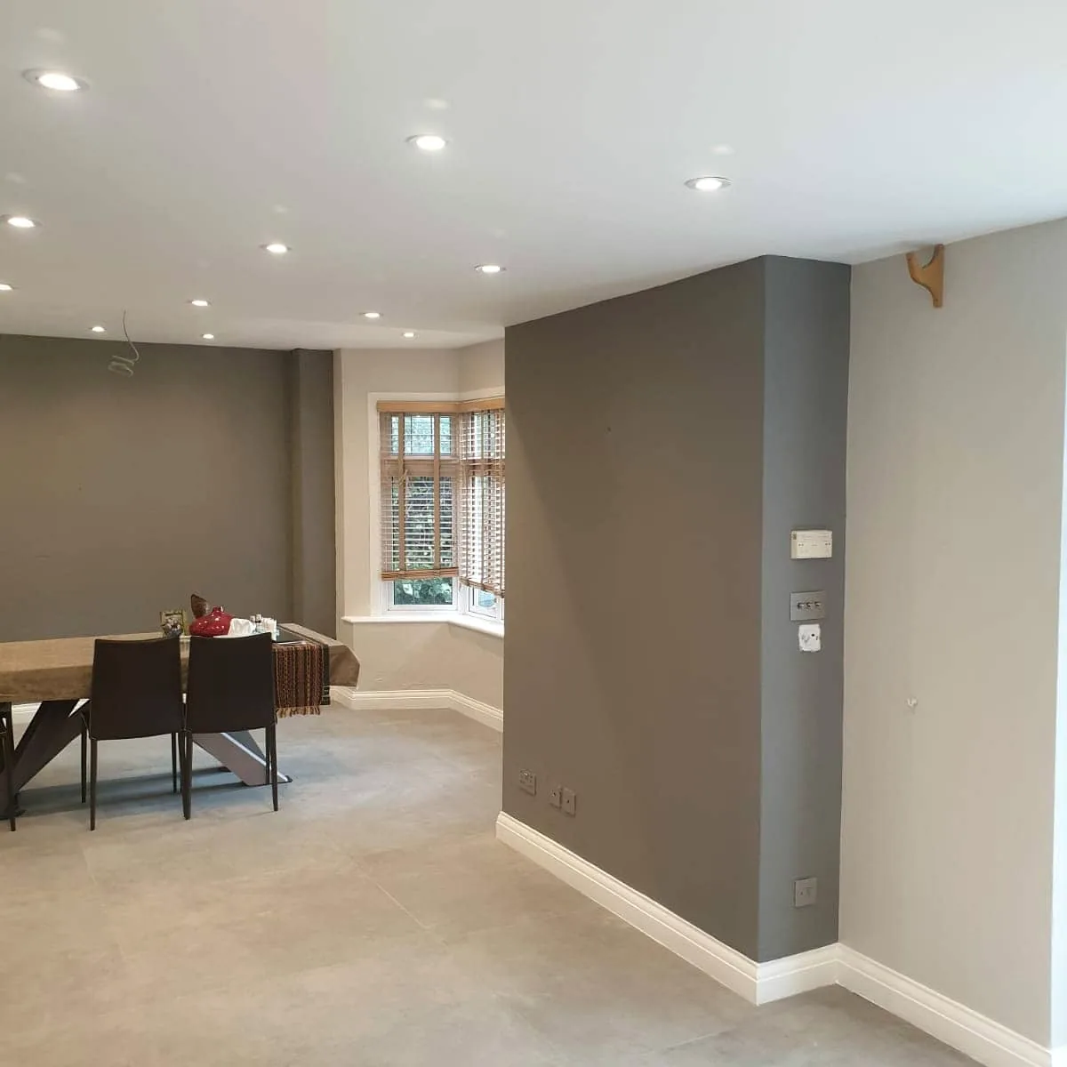 Completed neutral interior decoration with feature walls and clean white woodwork